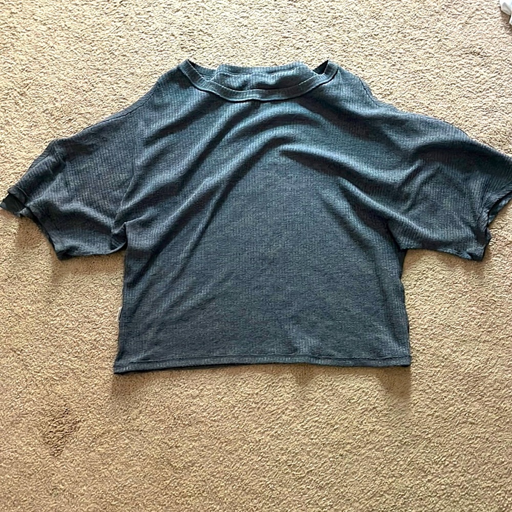 Sweater type with slits down the arm
